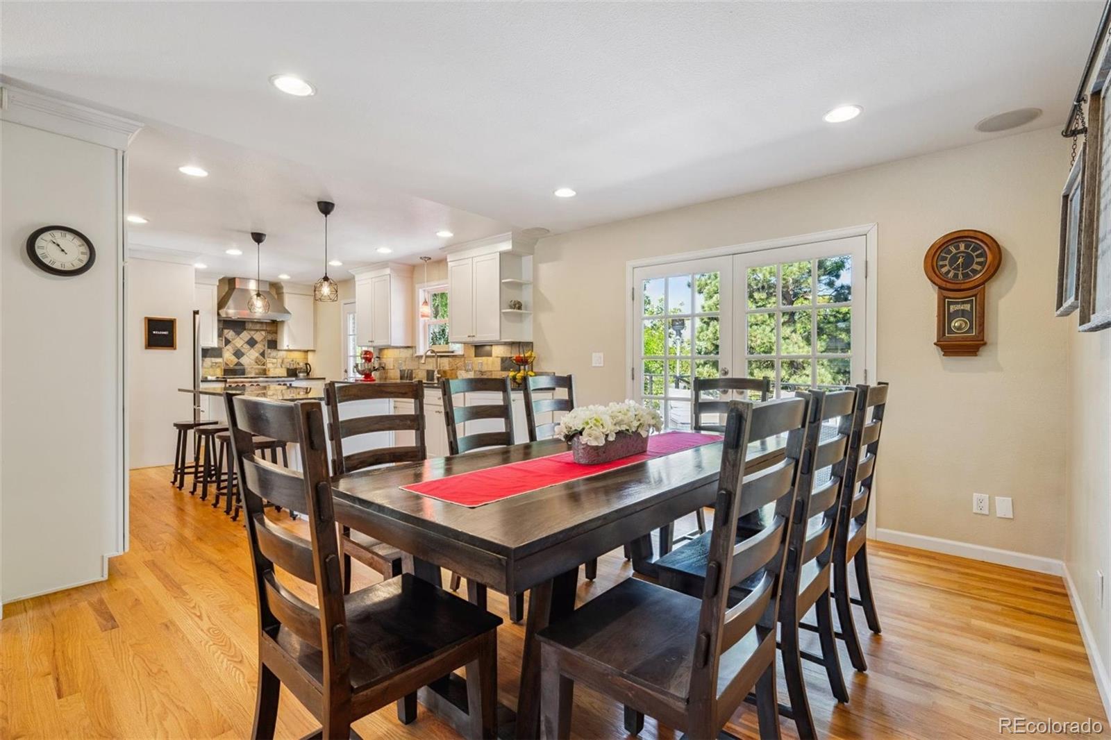 7659 South Fillmore Way Centennial, CO 80122 - Photo 8 of 45 a view of a dining room with furniture and wooden floor