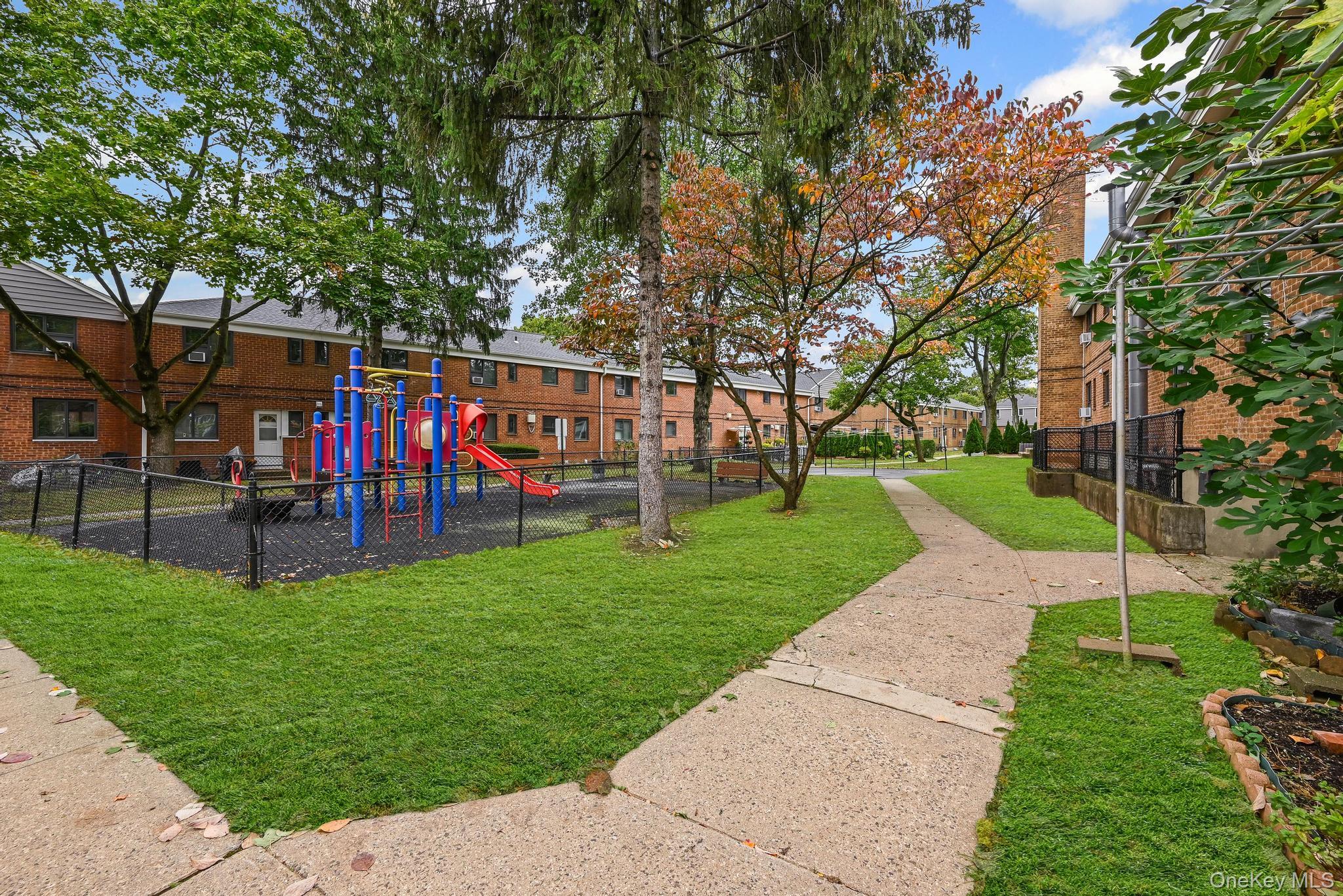 67-09 218th Street, Unit DUPLEX Queens, NY 11364 - Photo 14 of 22 a view of a park with large trees