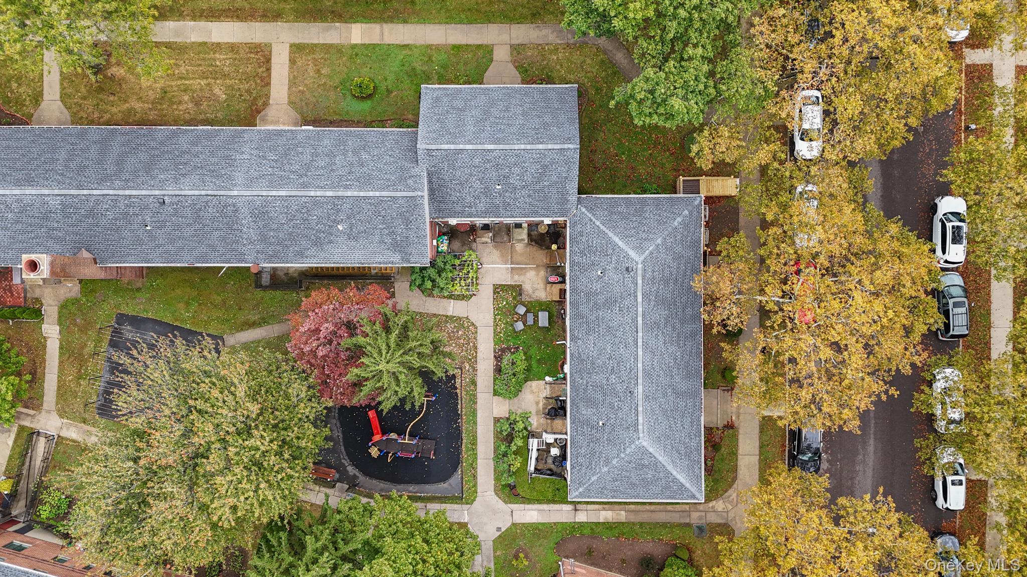 67-09 218th Street, Unit DUPLEX Queens, NY 11364 - Photo 15 of 22 front view of a house with a yard
