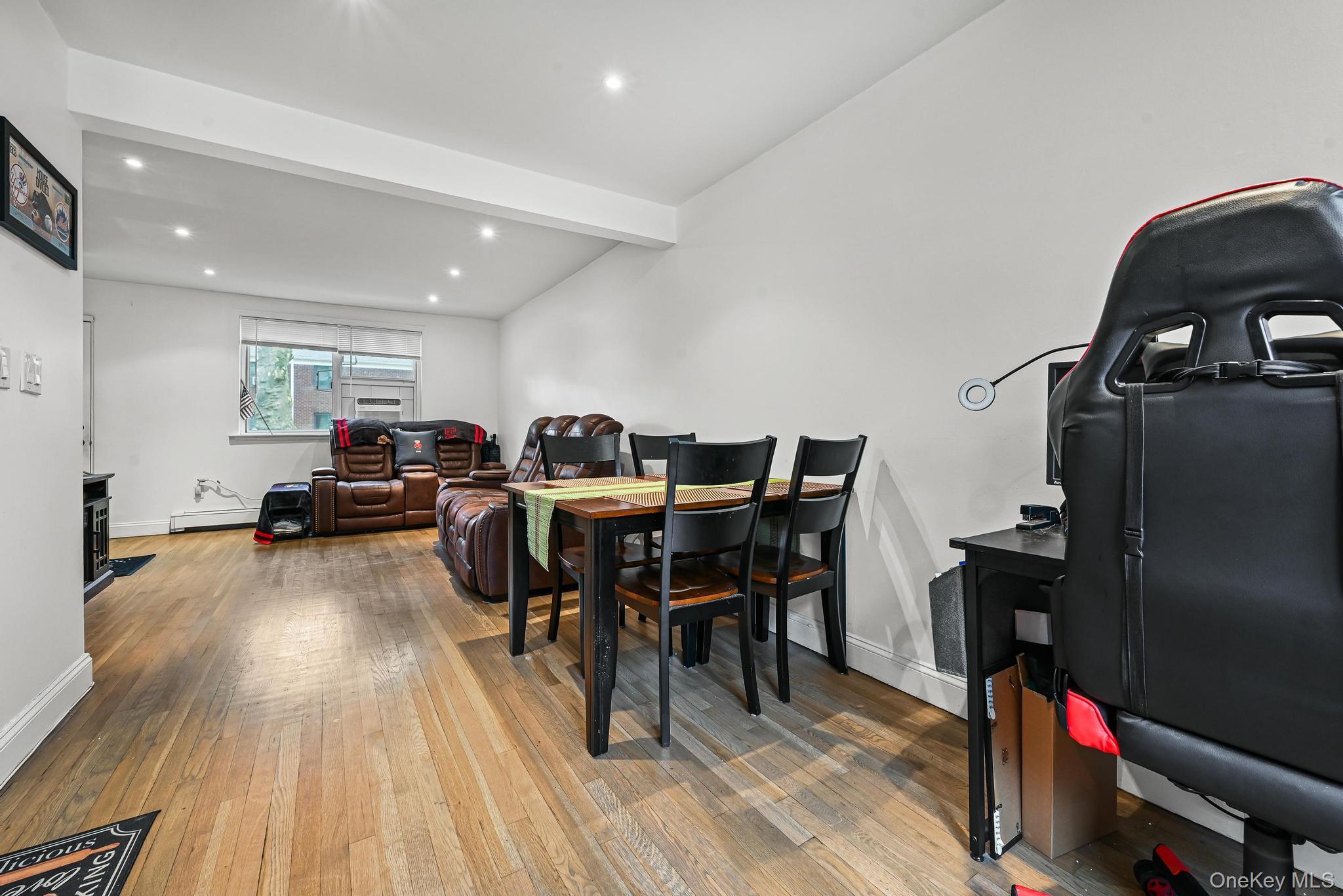 67-09 218th Street, Unit DUPLEX Queens, NY 11364 - Photo 5 of 22 a view of a dining room with furniture and wooden floor