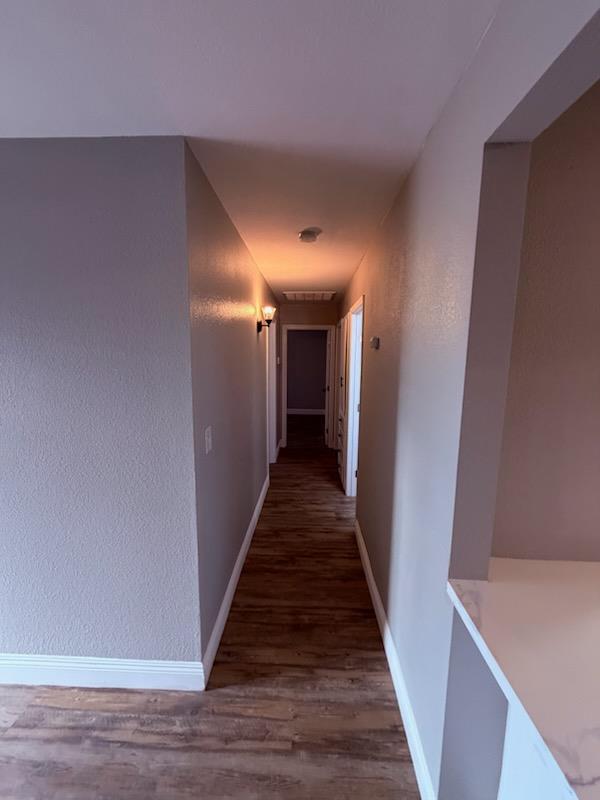 930 I Street Sanger, CA 93657 - Photo 11 of 15 a view of a hallway with wooden floor