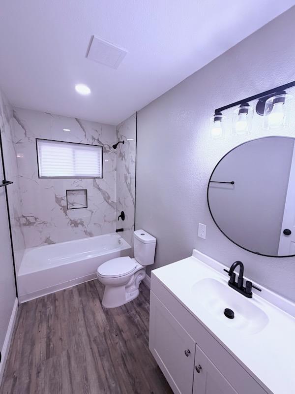 930 I Street Sanger, CA 93657 - Photo 13 of 15 a bathroom with a sink mirror and toilet