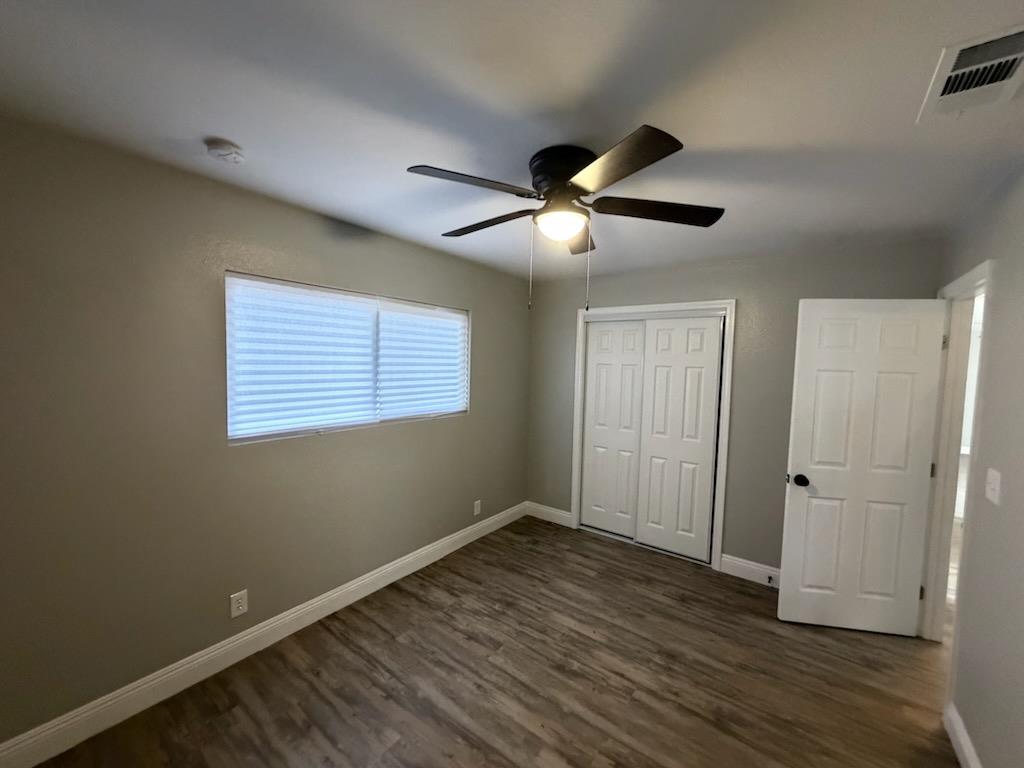930 I Street Sanger, CA 93657 - Photo 14 of 15 a view of an empty room with wooden floor