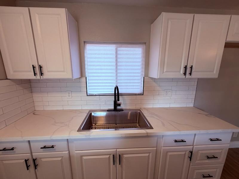 930 I Street Sanger, CA 93657 - Photo 9 of 15 a kitchen with a sink cabinets and appliances