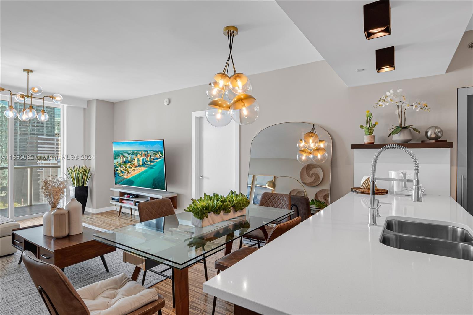 Brickell Miami, FL 33131 - Photo 14 of 61 a living room with furniture and a chandelier