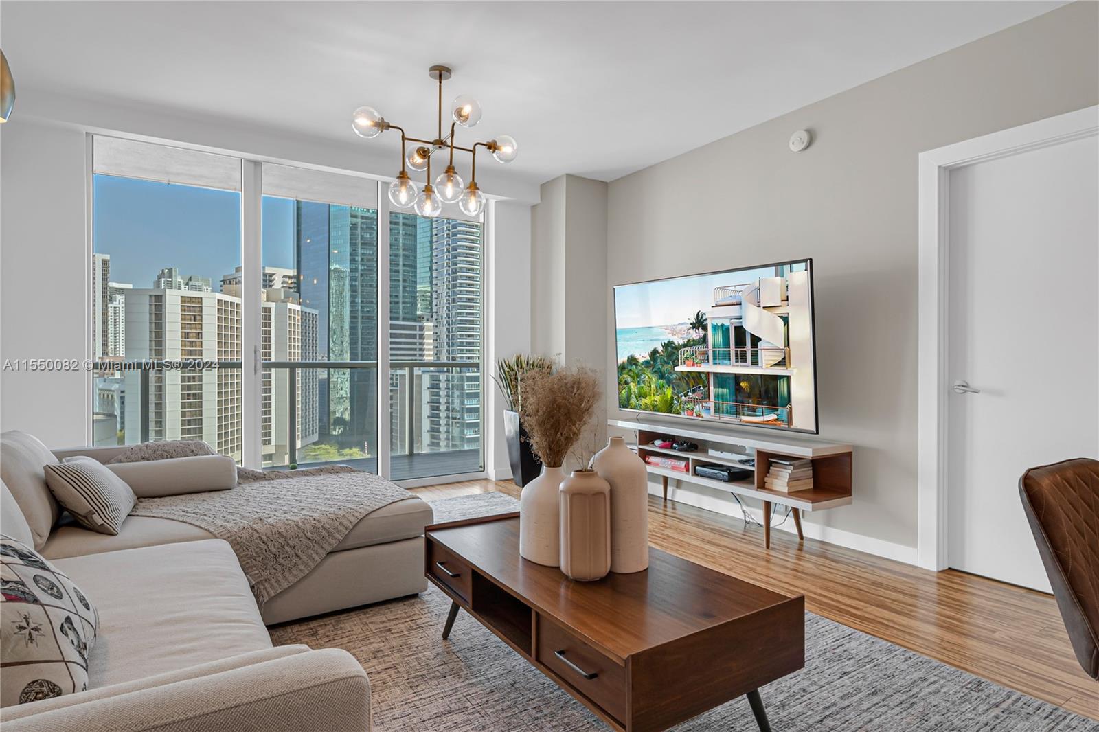 Brickell Miami, FL 33131 - Photo 15 of 61 a living room with furniture a large window and a table