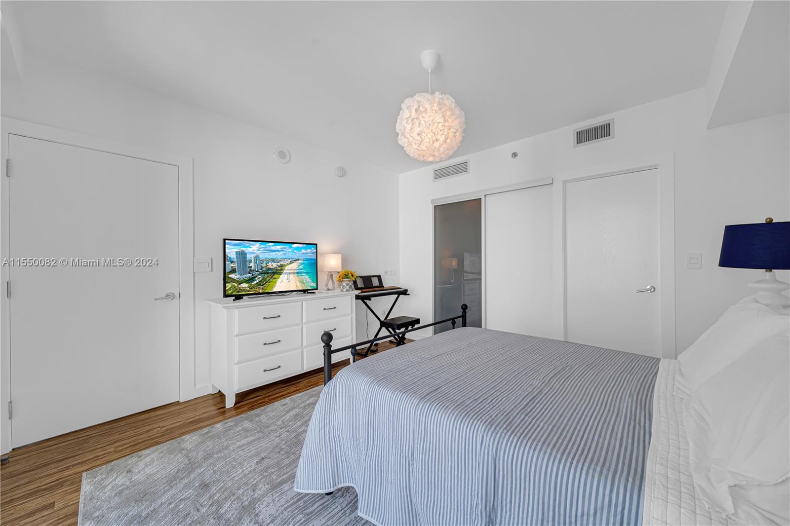 Brickell Miami, FL 33131 - Photo 19 of 61 a bedroom with a bed and a flat screen tv