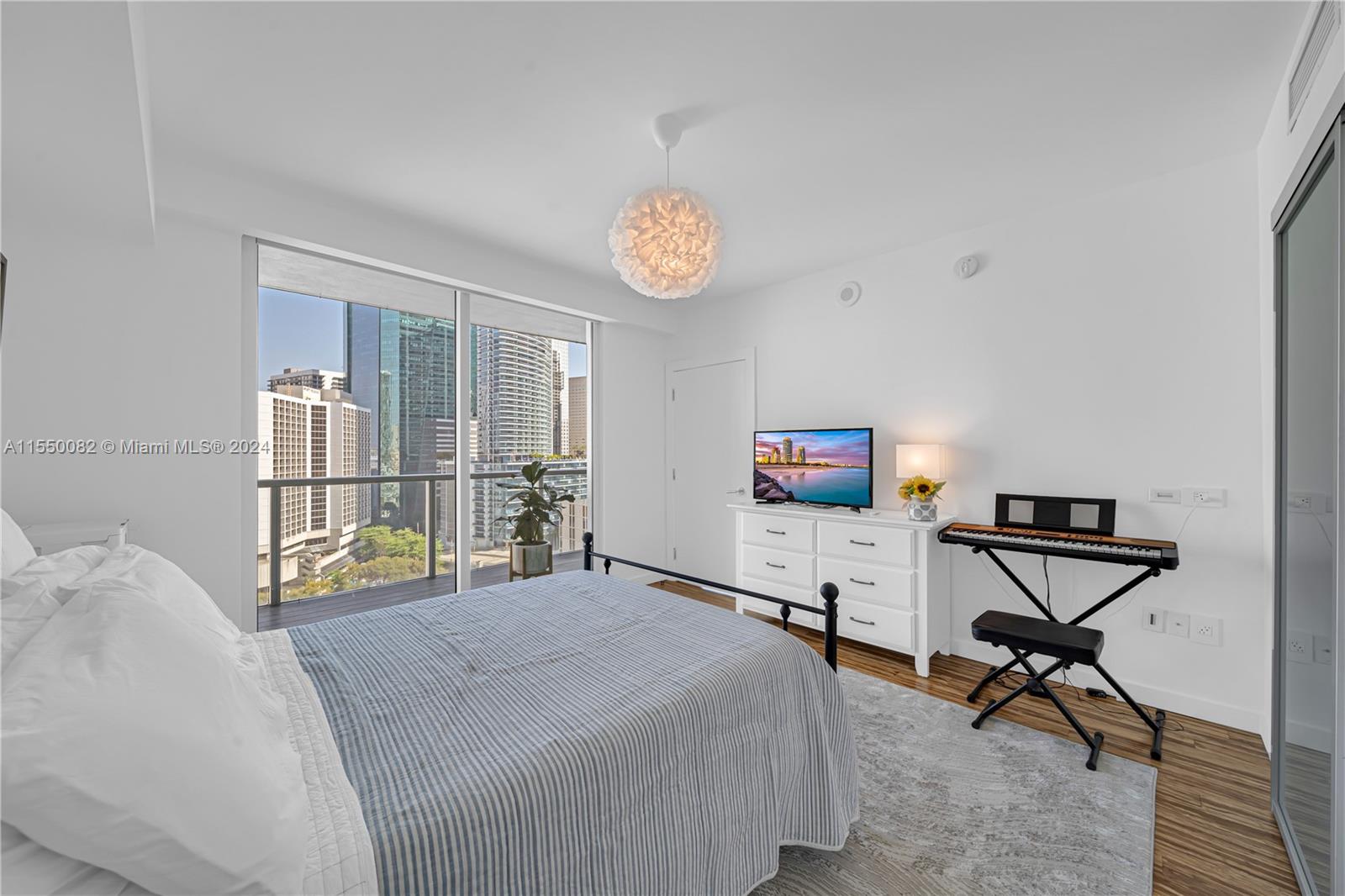 Brickell Miami, FL 33131 - Photo 20 of 61 a bedroom with a bed and a desk