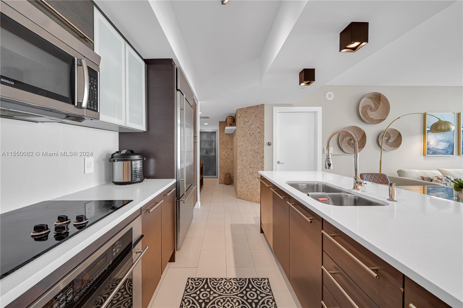 Brickell Miami, FL 33131 - Photo 3 of 61 a kitchen with a sink and refrigerator