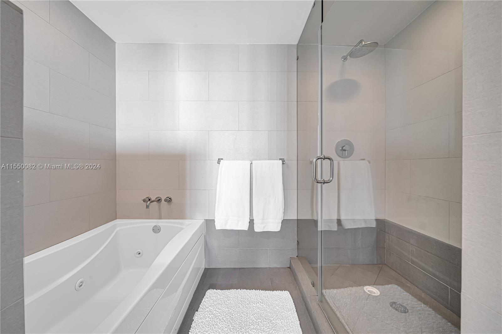 Brickell Miami, FL 33131 - Photo 35 of 61 a bathroom with a bathtub and a shower