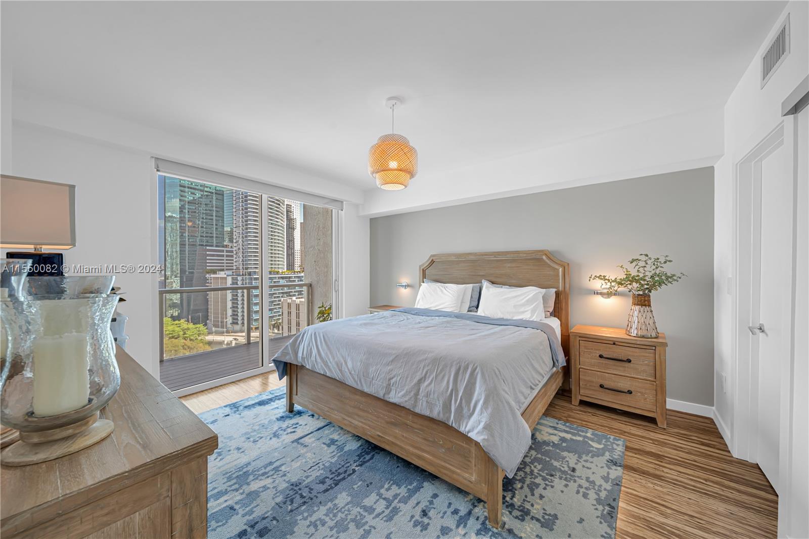 Brickell Miami, FL 33131 - Photo 39 of 61 a bedroom with a balcony a bed and a couch