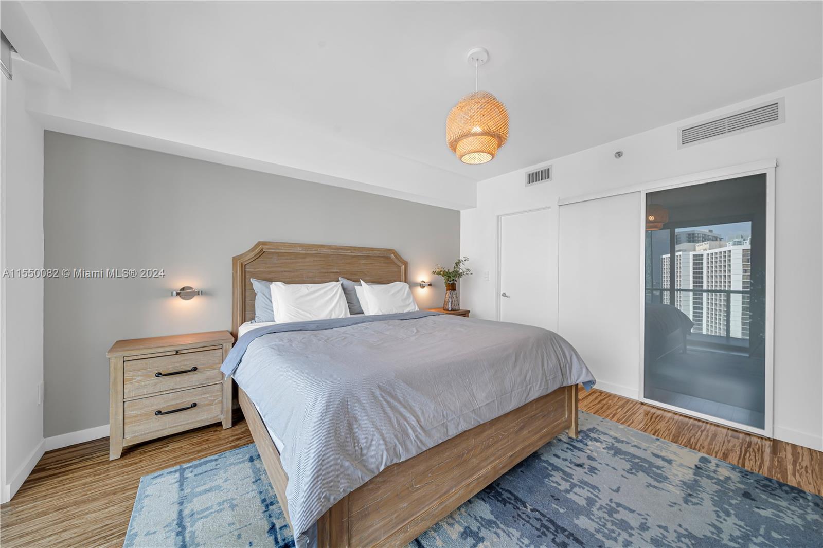 Brickell Miami, FL 33131 - Photo 41 of 61 a bedroom with a bed and window