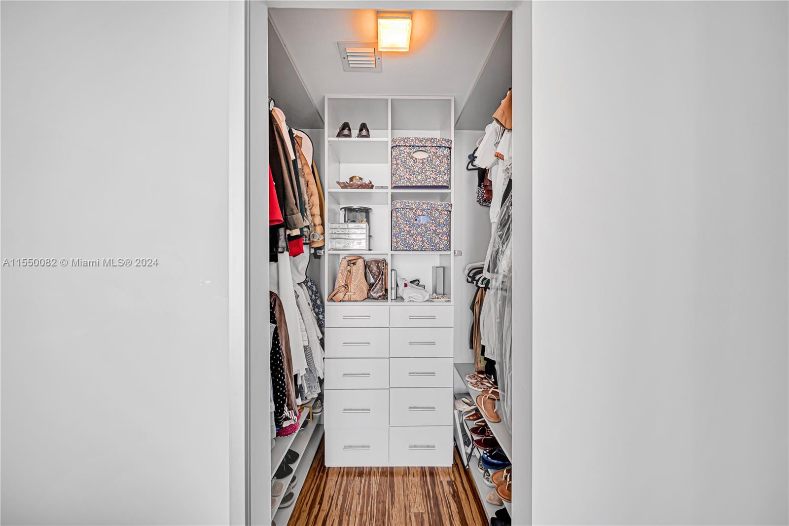 Brickell Miami, FL 33131 - Photo 44 of 61 a view of walk in closet with clothes