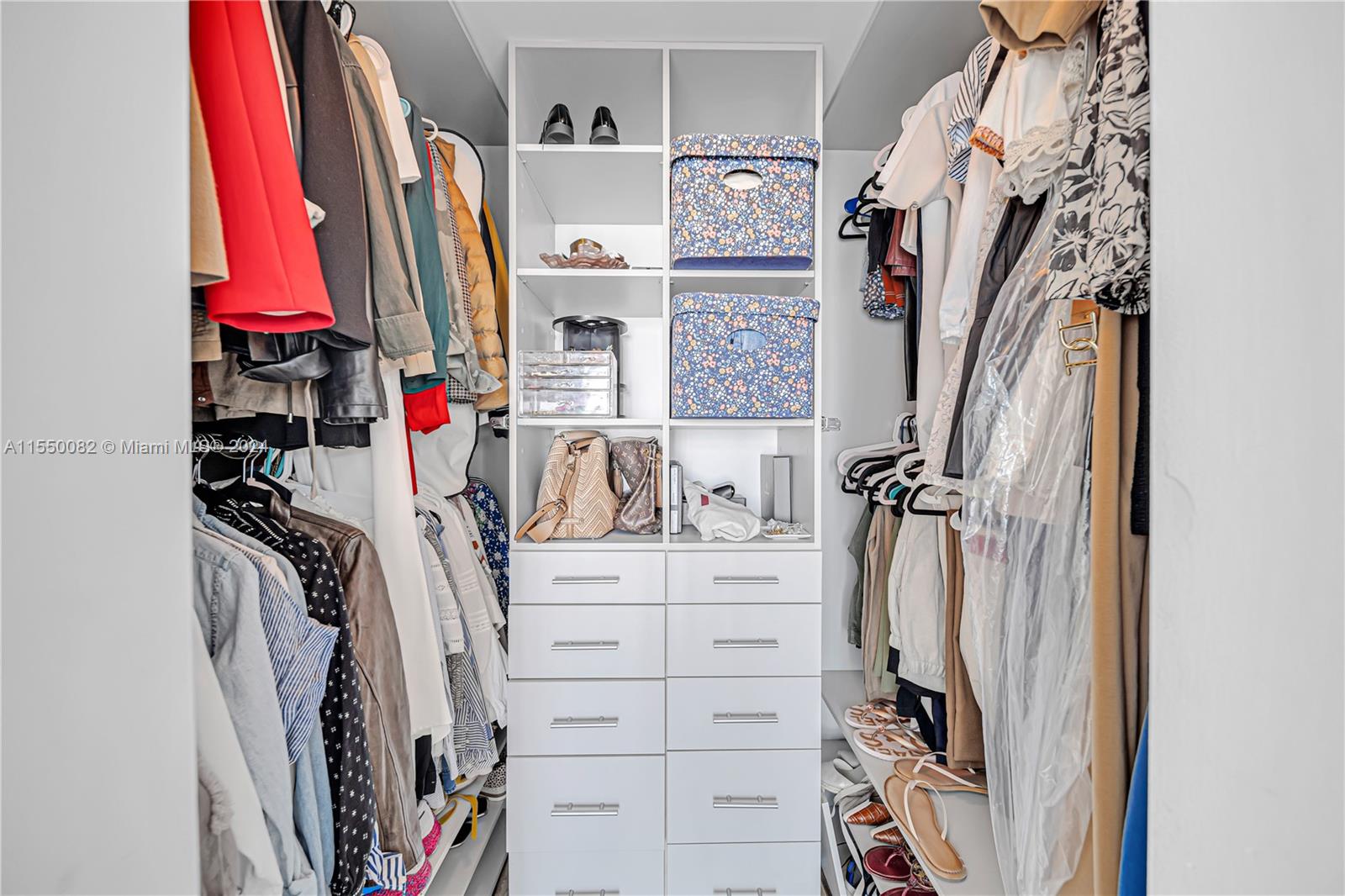 Brickell Miami, FL 33131 - Photo 45 of 61 a view of walk in closet with clothes
