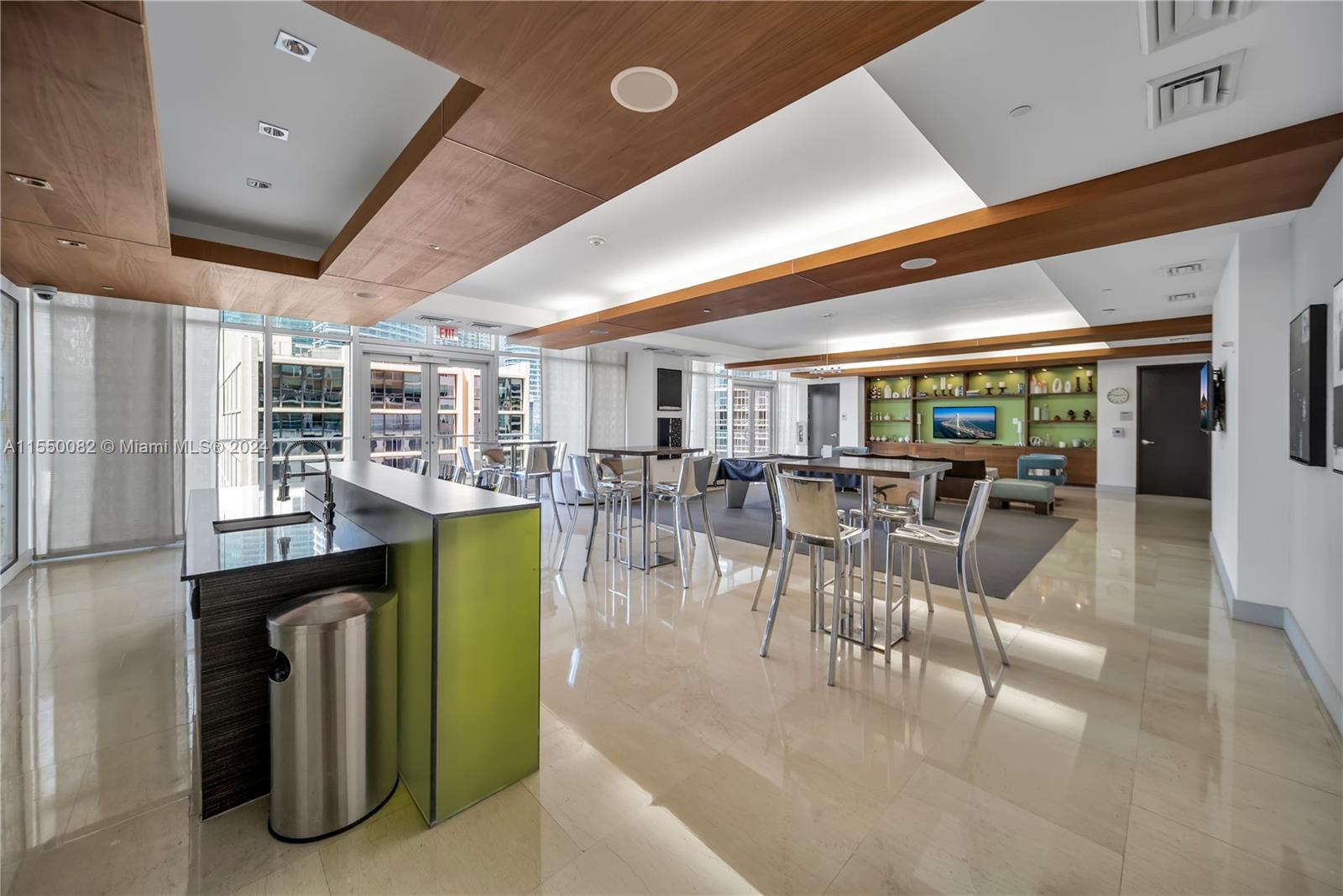 Brickell Miami, FL 33131 - Photo 48 of 61 a dining hall with stainless steel appliances granite countertop a refrigerator a table and chairs