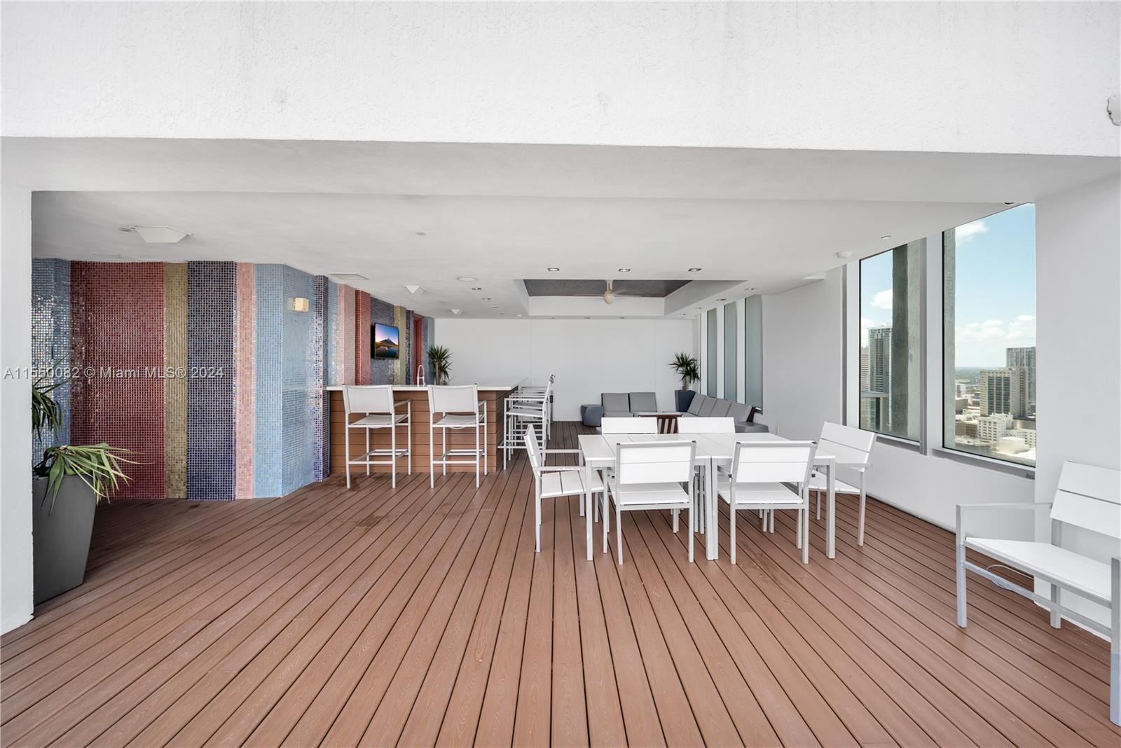 Brickell Miami, FL 33131 - Photo 52 of 61 a view of a dining room with furniture window and wooden floor