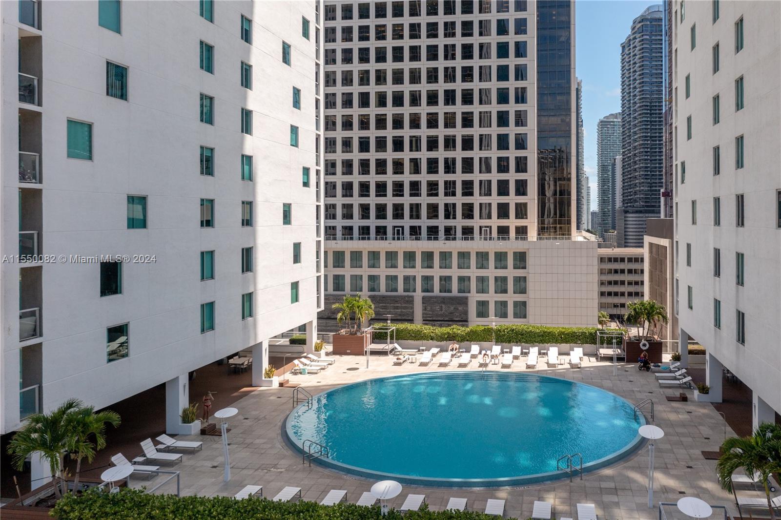 Brickell Miami, FL 33131 - Photo 55 of 61 a view of a swimming pool with a yard