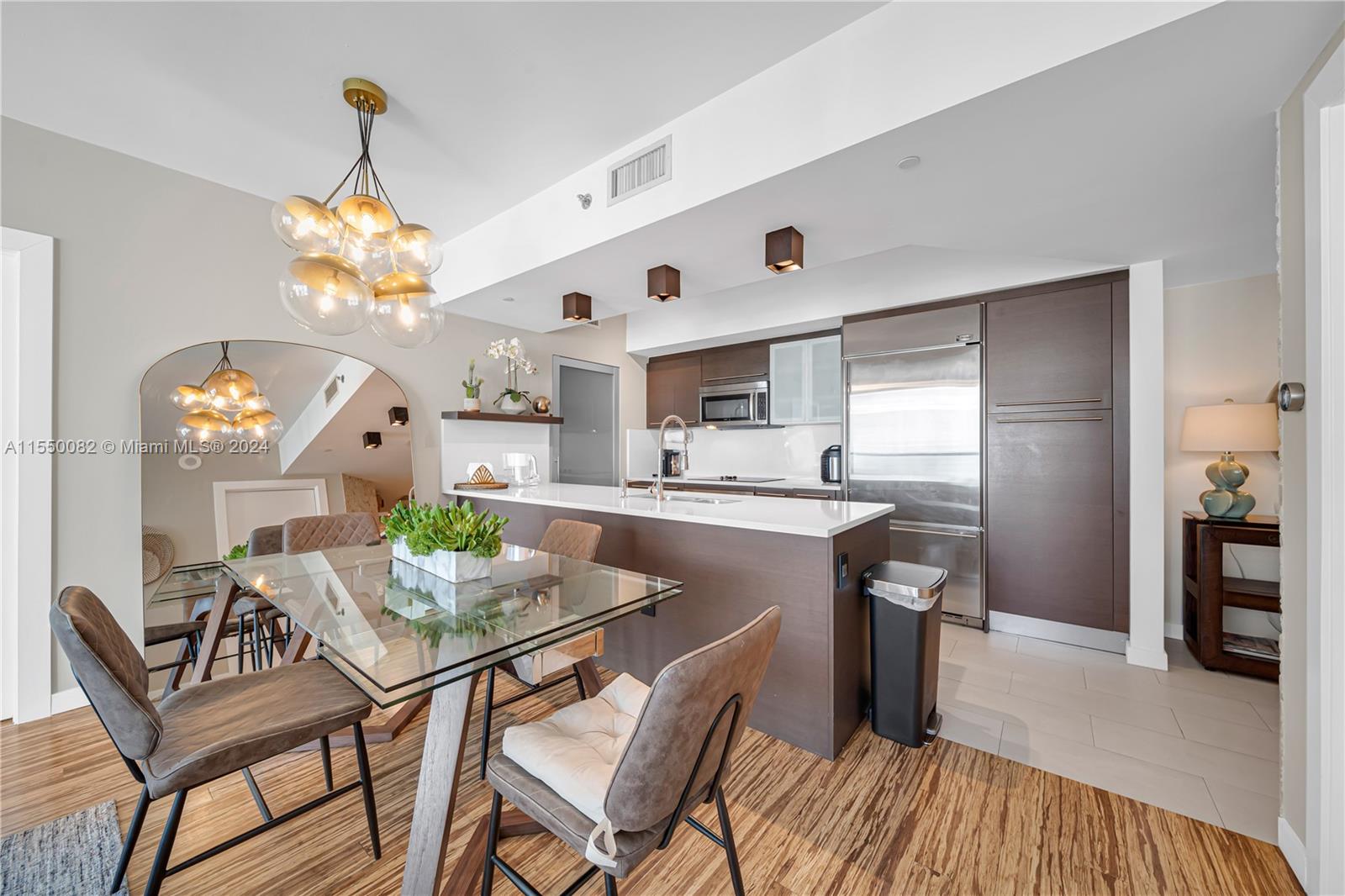Brickell Miami, FL 33131 - Photo 7 of 61 a view of a dining room with furniture and wooden floor