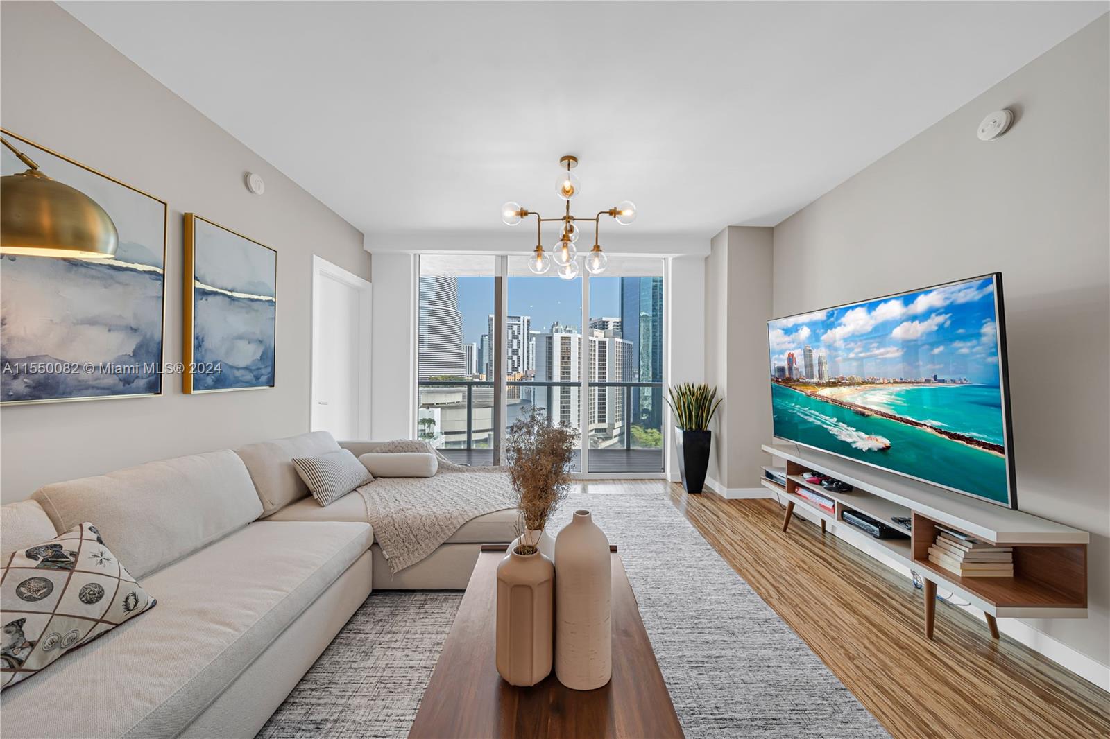 Brickell Miami, FL 33131 - Photo 8 of 61 a living room with furniture and a flat screen tv