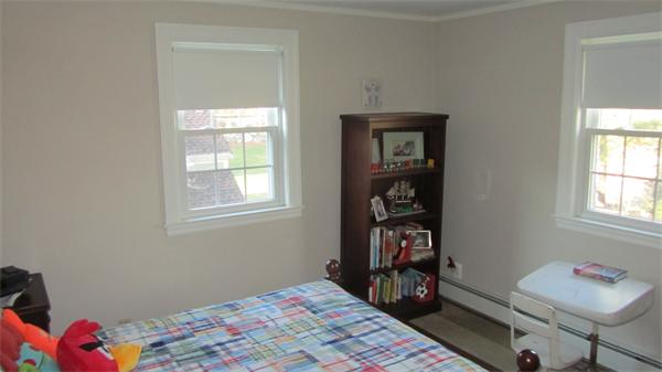 45 Clifton Road Milton, MA 02186 - Photo 11 of 19 a bedroom with a bed and a window