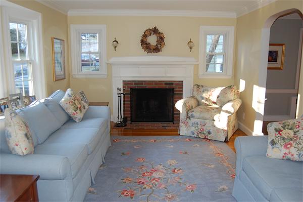 45 Clifton Road Milton, MA 02186 - Photo 5 of 19 a living room with furniture and a fireplace