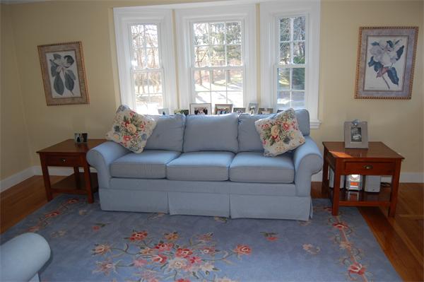 45 Clifton Road Milton, MA 02186 - Photo 6 of 19 a living room with furniture and a large window