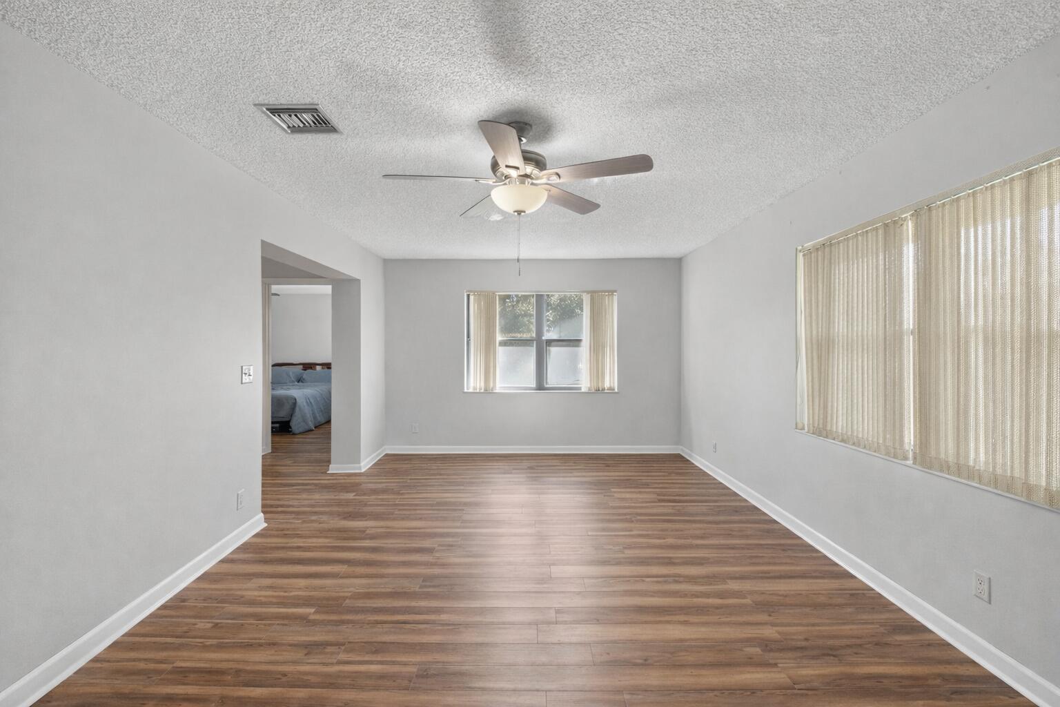 738 Northwest 24th Avenue Delray Beach, FL 33445 - Photo 4 of 45 Empty living room with natural light