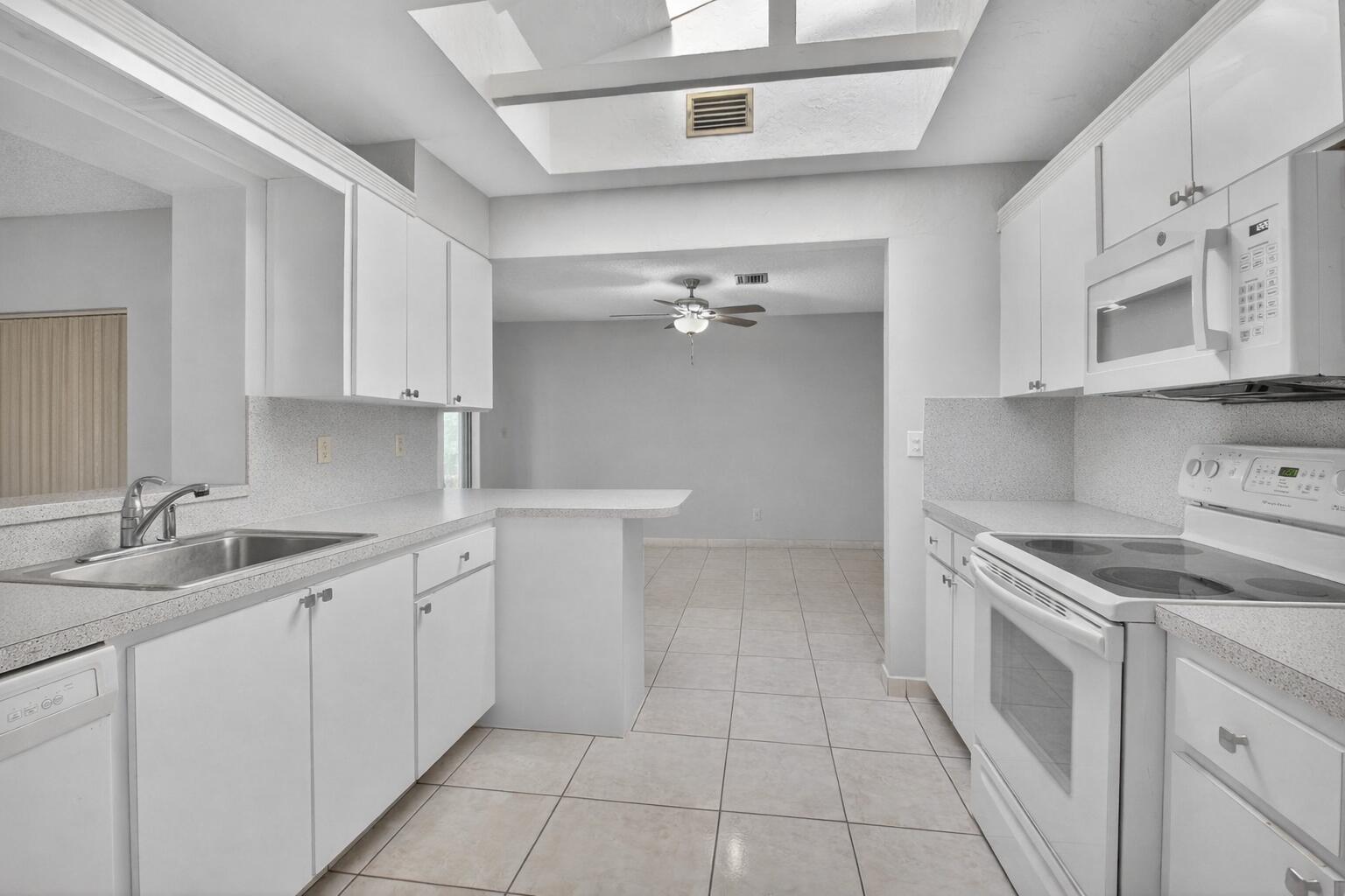 738 Northwest 24th Avenue Delray Beach, FL 33445 - Photo 5 of 45 Bright modern kitchen with sleek design