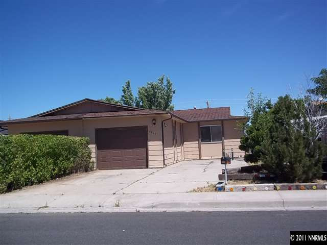 6865 Lotus Street Reno, NV 89506 - Photo 1 of 9 a front view of a house with a yard