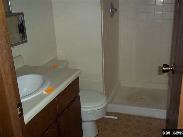 6865 Lotus Street Reno, NV 89506 - Photo 6 of 9 a bathroom with a sink a toilet and shower