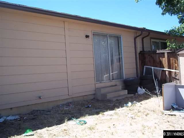 6865 Lotus Street Reno, NV 89506 - Photo 8 of 9 a backyard of a house