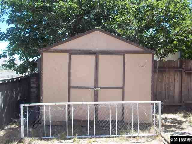 6865 Lotus Street Reno, NV 89506 - Photo 9 of 9 a front view of a house with a fence