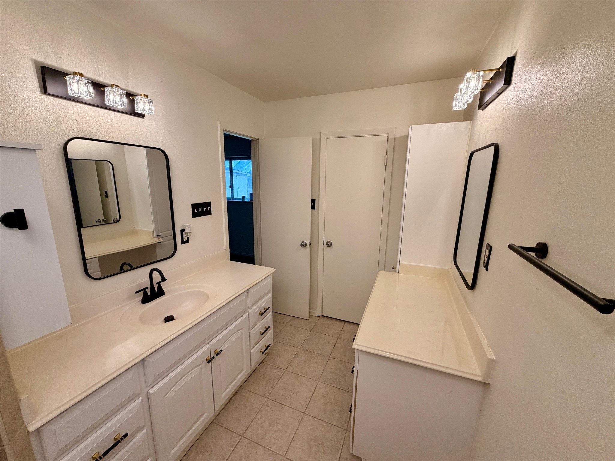 1411 Neptune Lane Houston, TX 77062 - Photo 13 of 23 a bathroom with a sink a toilet and mirror