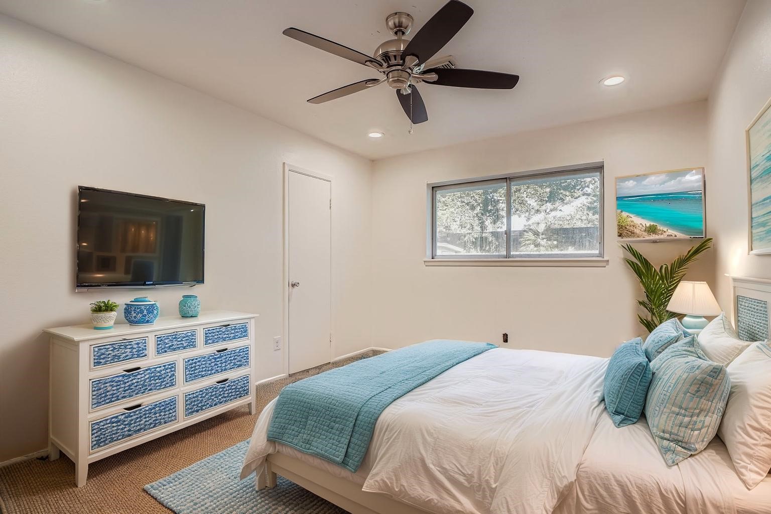 1411 Neptune Lane Houston, TX 77062 - Photo 14 of 23 a bedroom with a bed and a flat screen tv