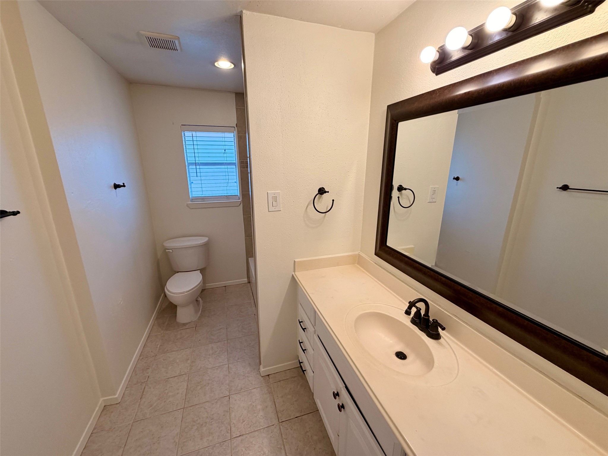 1411 Neptune Lane Houston, TX 77062 - Photo 17 of 23 a bathroom with a sink and a mirror