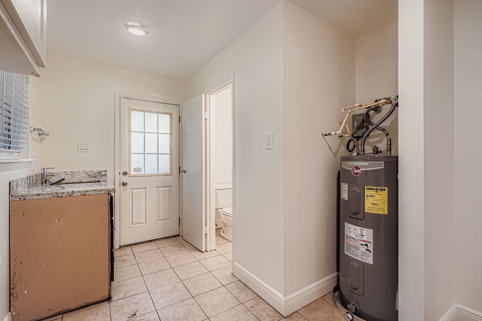 1411 Neptune Lane Houston, TX 77062 - Photo 9 of 23 a view of a storage & utility room with closet window