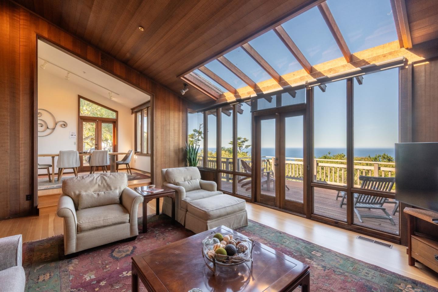 214 Crest Road Carmel, CA 93923 - Photo 4 of 29 a living room with furniture and a floor to ceiling window