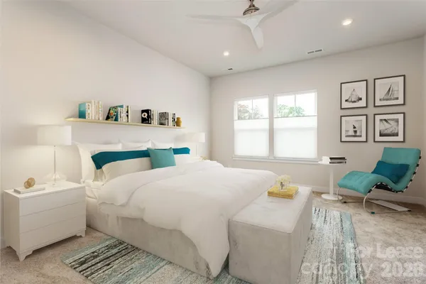 a bedroom with a bed and a couch