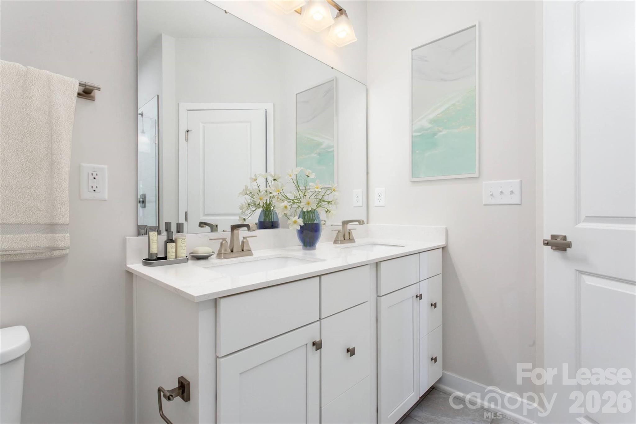 657 Uwharrie River Road Charlotte, NC 28211 - Photo 14 of 16 a bathroom with a sink and a mirror