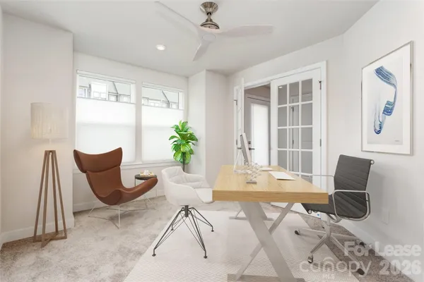 a view of a livingroom with furniture and a window