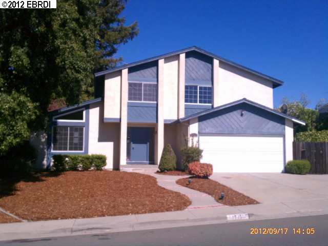 1715 Redwood Road Hercules, CA 94547 - Photo 1 of 1 a front view of a house with a yard and garage