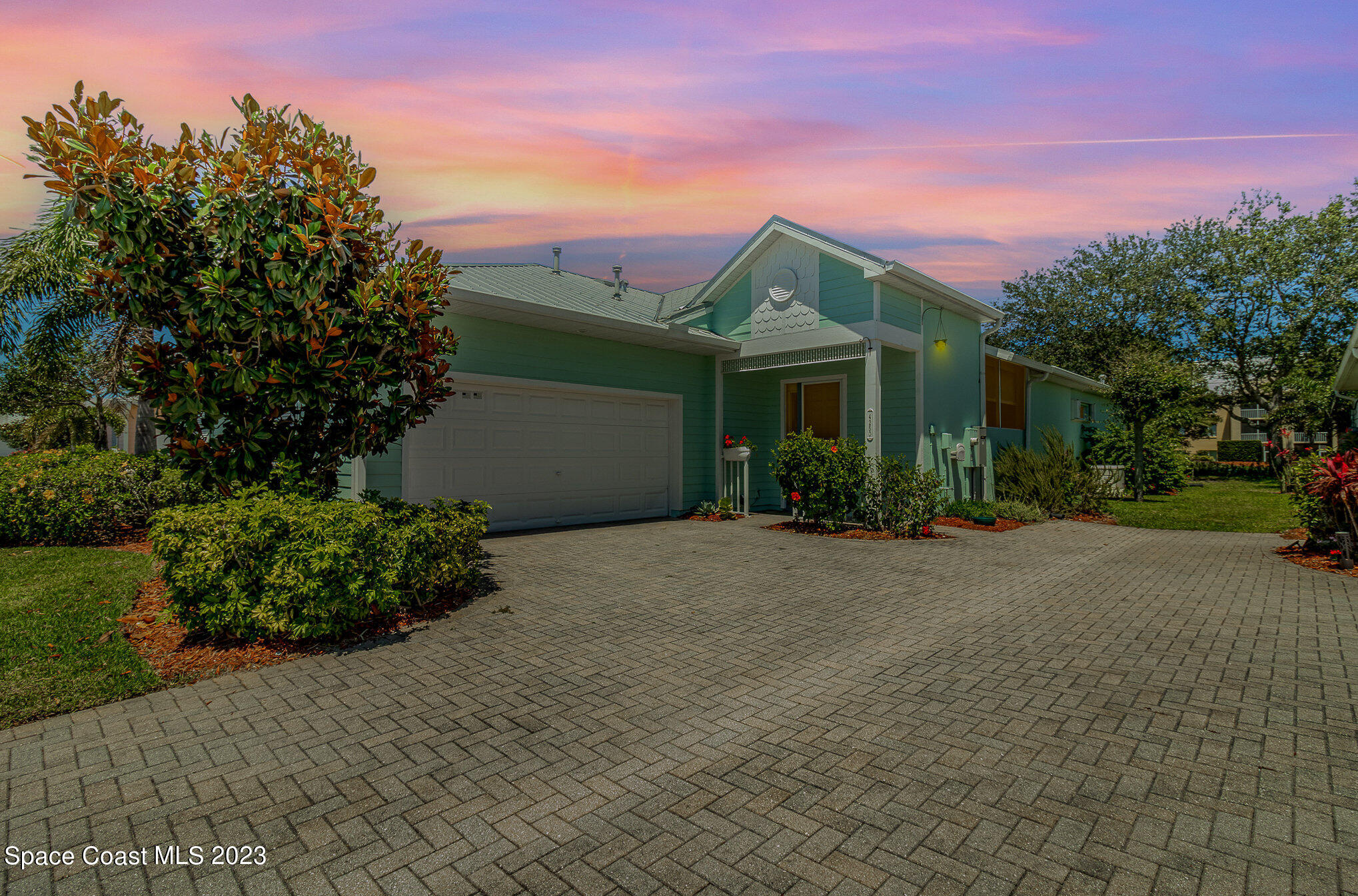 4250 Alamanda Key Drive Melbourne, FL 32901 - Photo 2 of 33 a front view of a house with a garden