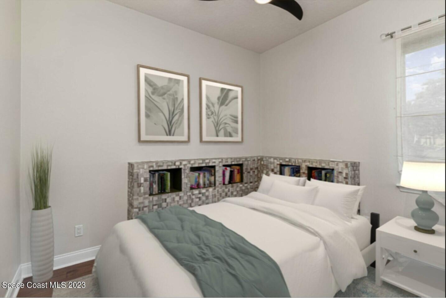 4250 Alamanda Key Drive Melbourne, FL 32901 - Photo 21 of 33 a bedroom with a large bed and a window