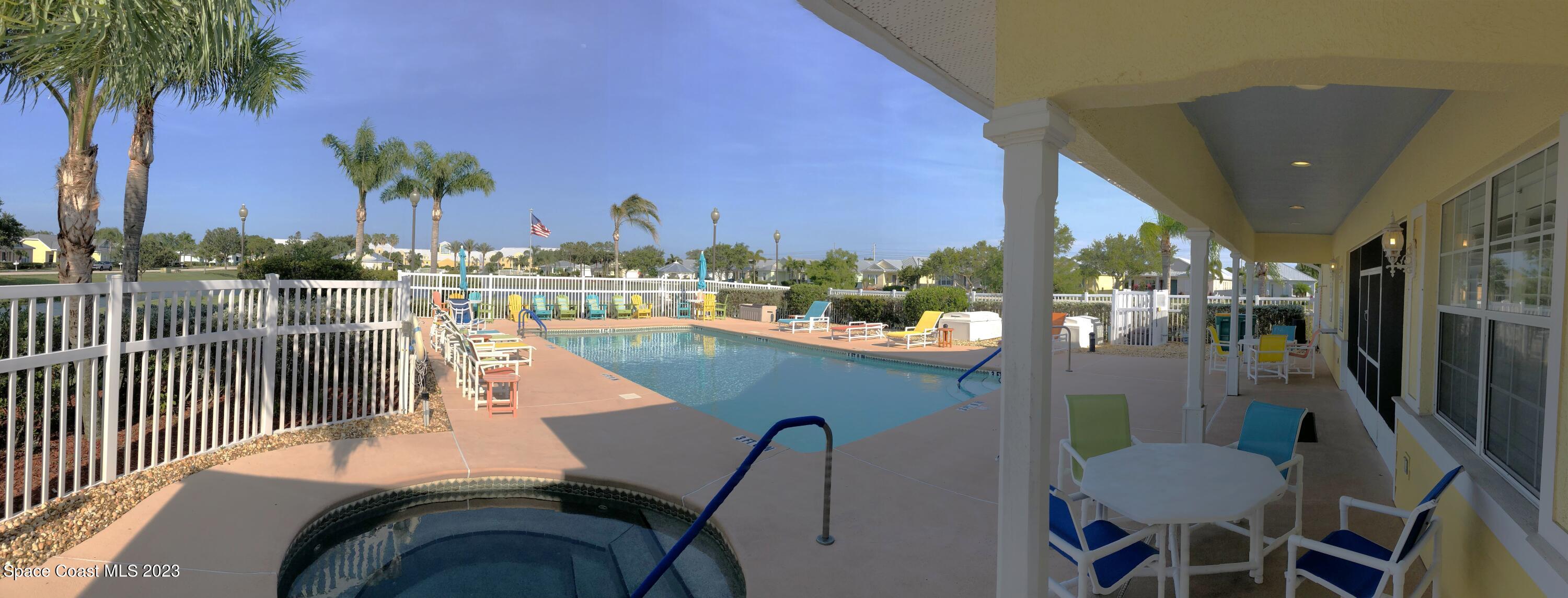 4250 Alamanda Key Drive Melbourne, FL 32901 - Photo 31 of 33 a view of a swimming pool with outdoor seating and plants