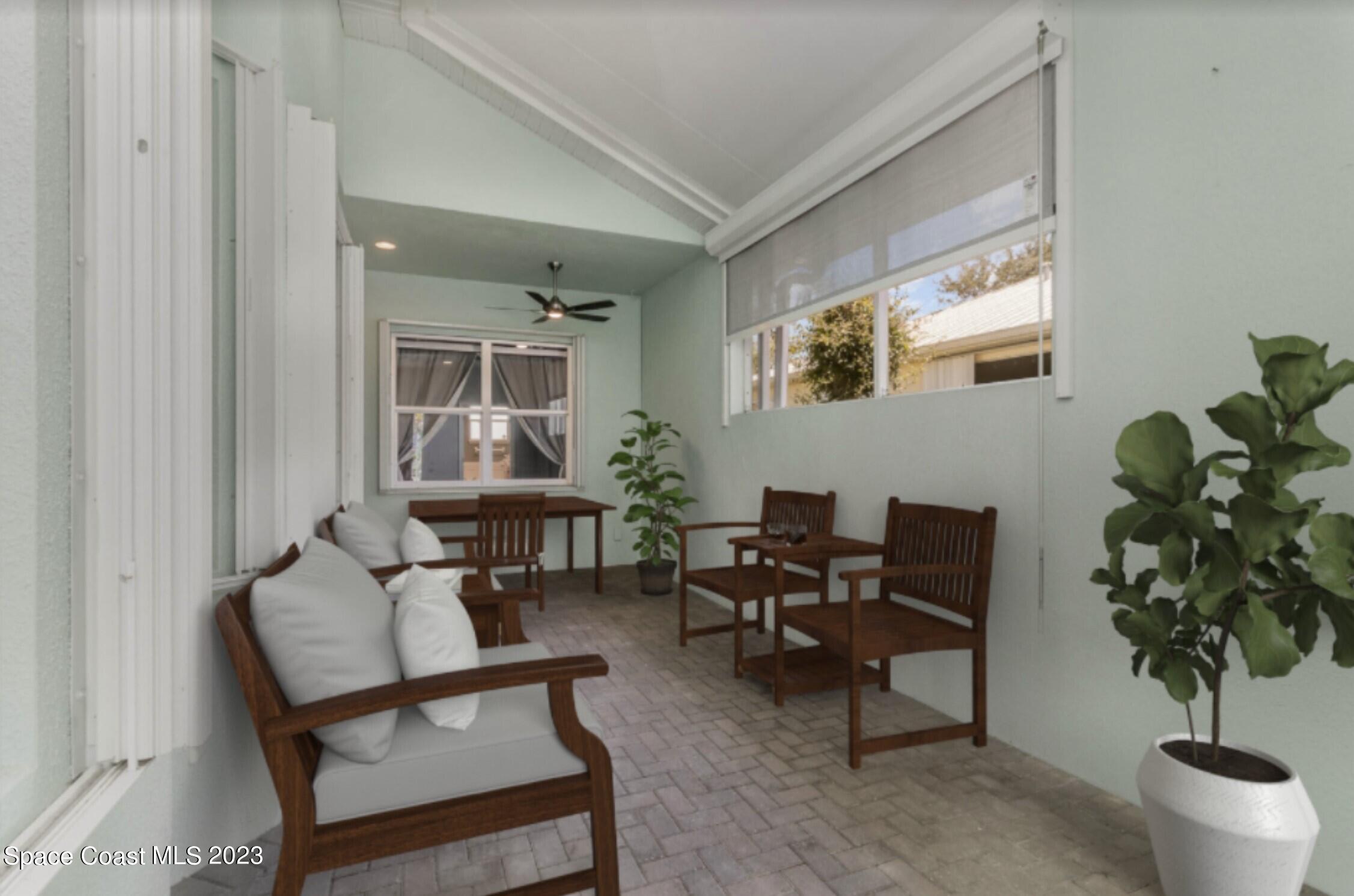 4250 Alamanda Key Drive Melbourne, FL 32901 - Photo 7 of 33 a living room with furniture and a potted plant