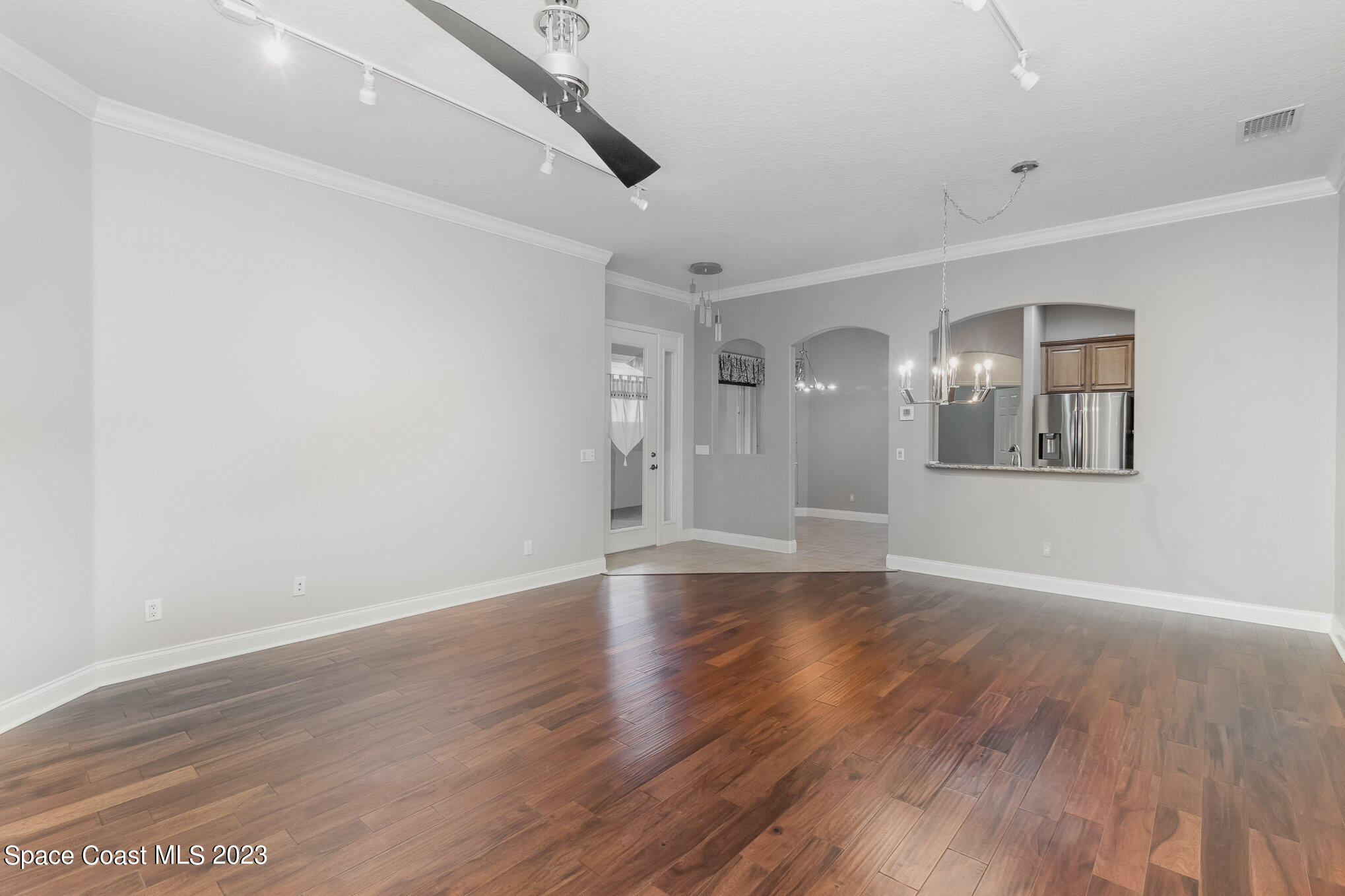 4250 Alamanda Key Drive Melbourne, FL 32901 - Photo 9 of 33 wooden floor in an empty room with a window