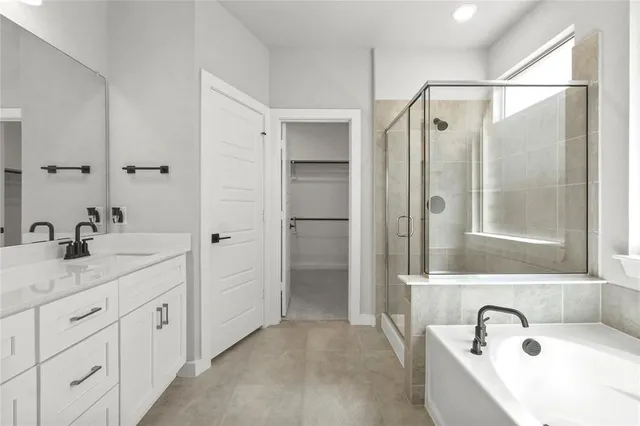 a bathroom with double sink and a mirror