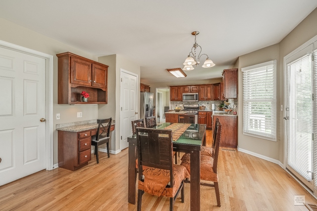 1805 Marne Road Bolingbrook, IL 60490 - Photo 11 of 27 a view of a dining room with furniture window and wooden floor