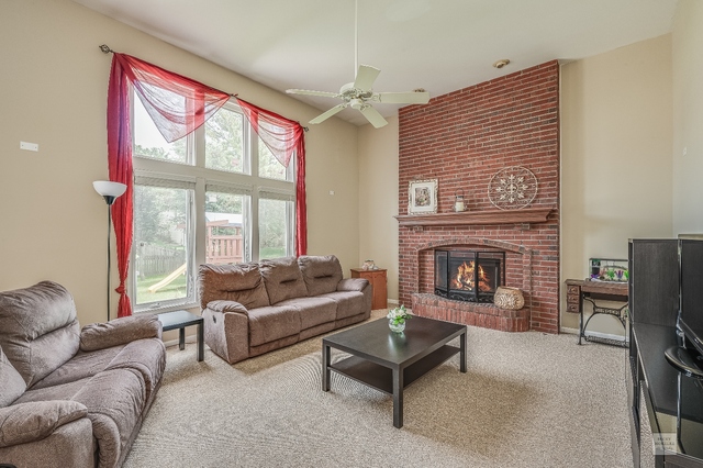 1805 Marne Road Bolingbrook, IL 60490 - Photo 14 of 27 a living room with furniture and a fireplace