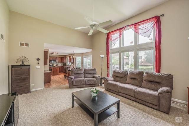 1805 Marne Road Bolingbrook, IL 60490 - Photo 15 of 27 a living room with furniture and a large window